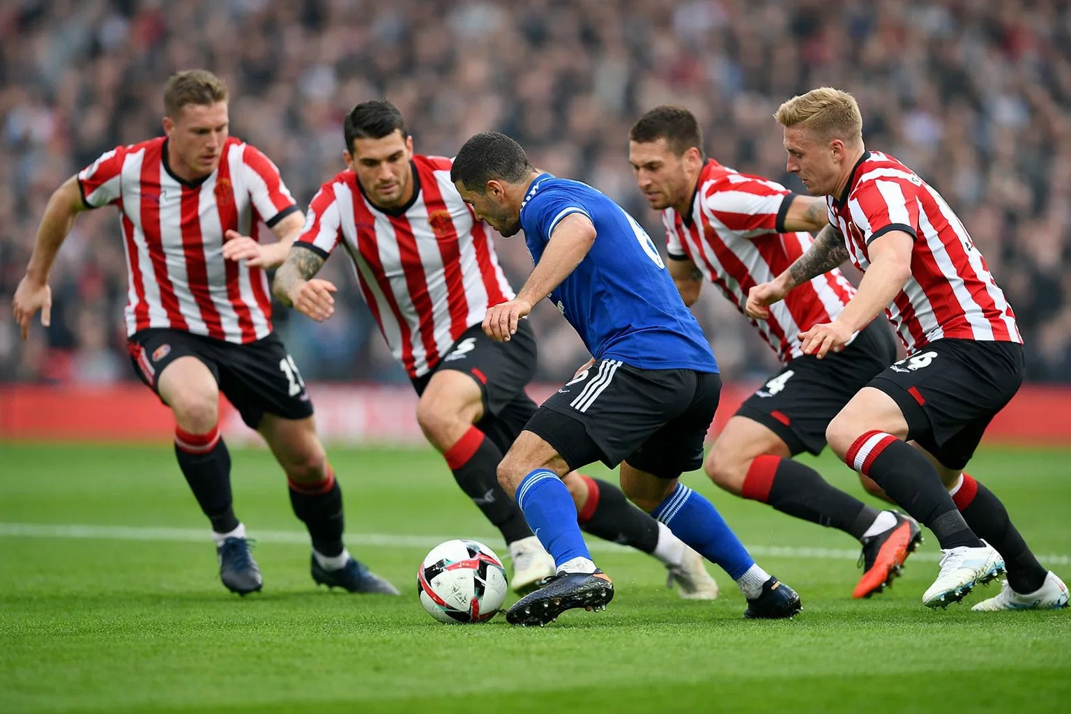 Football players pressing high up the pitch during Premier League match