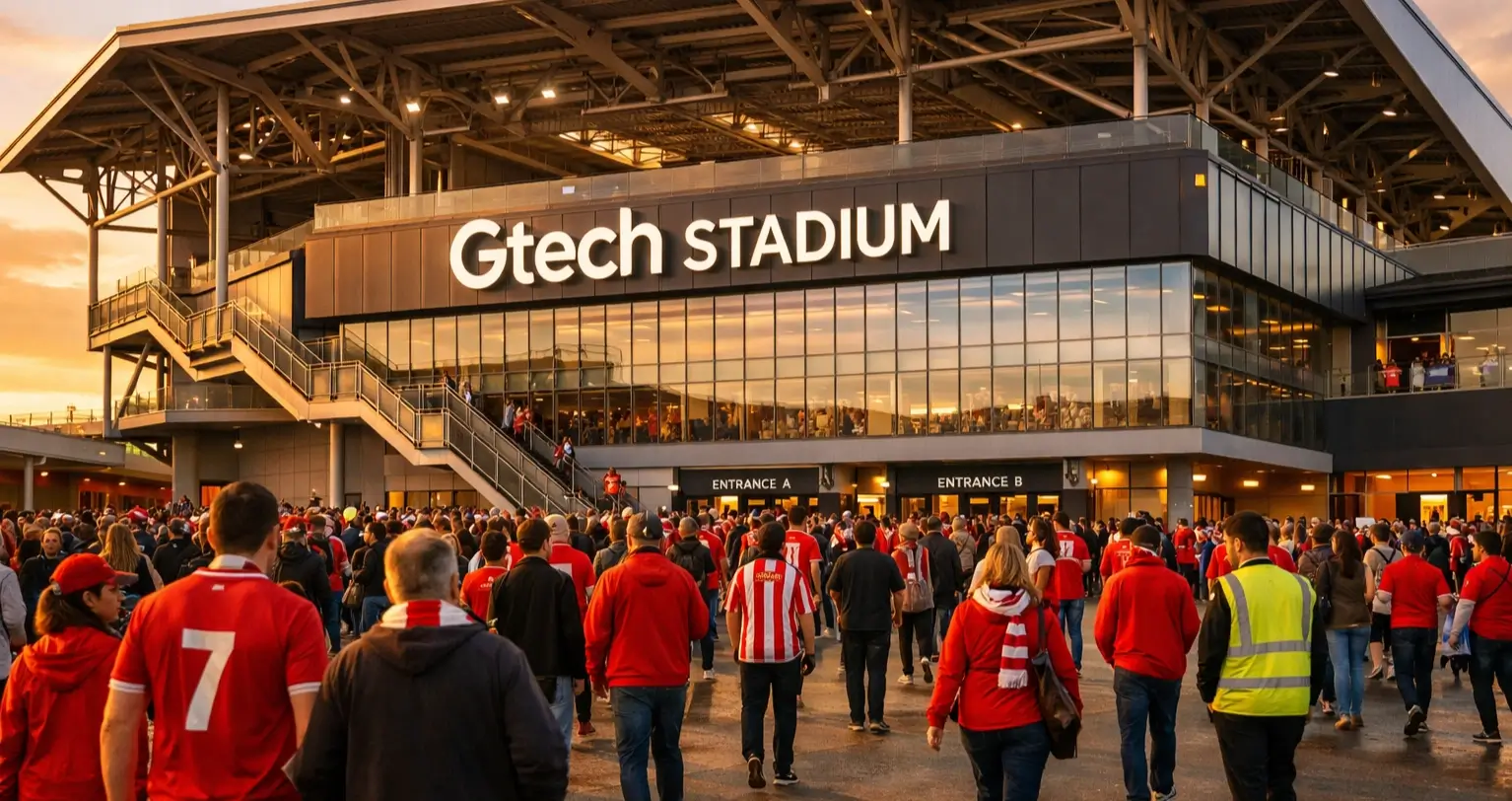 Exterior view of Gtech Community Stadium on matchday with fans gathering outside